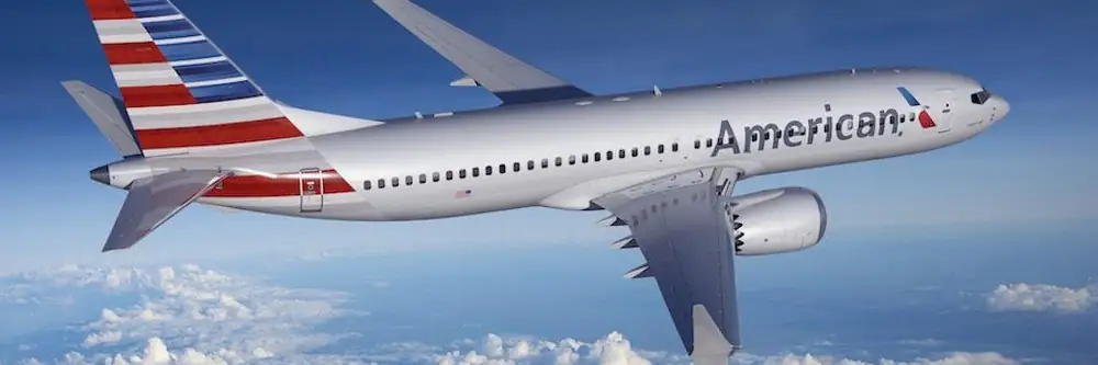 American Airlines jet above the clouds
